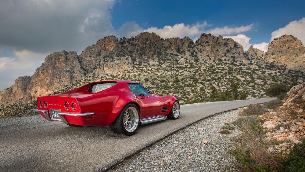 Classic Red Beauty against Majestic Mountains wallpaper