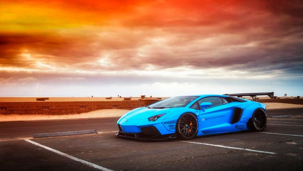 Sleek Blue Machine under Fiery Skies wallpaper