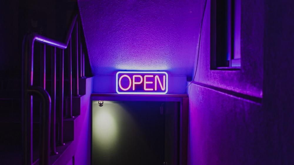 Neon Open Sign Welcomes Nighttime Visitors wallpaper