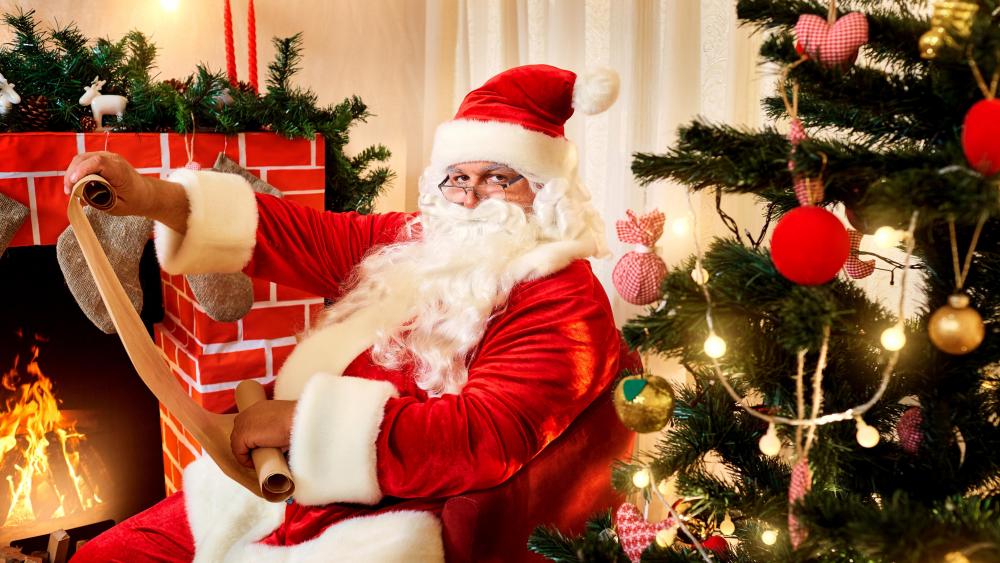 Santa Claus Preparing for Christmas Eve wallpaper