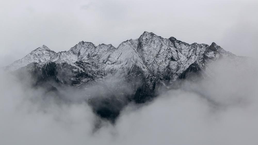 Majestic Peaks Shrouded in Mist wallpaper