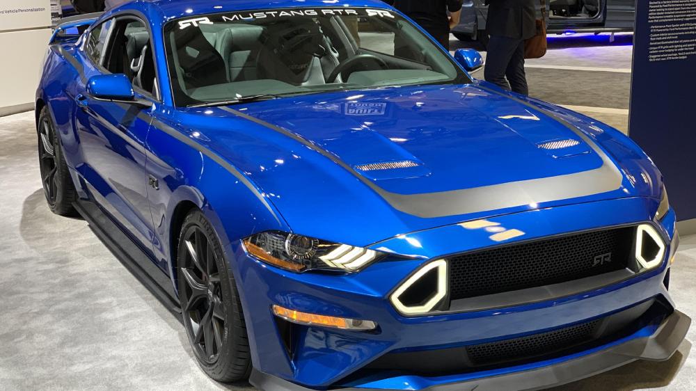High-Performance Blue Mustang on Display wallpaper