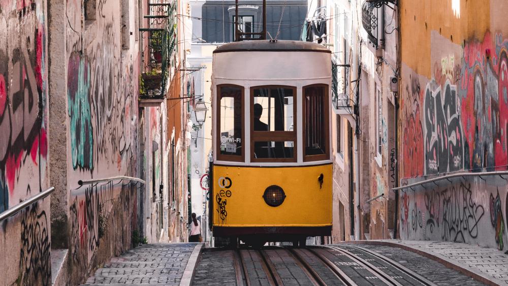 Vintage Yellow Tram on Urban Track wallpaper