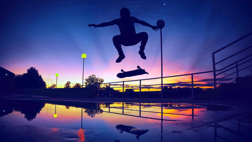 Skateboard Jump at Sunset Silhouette wallpaper