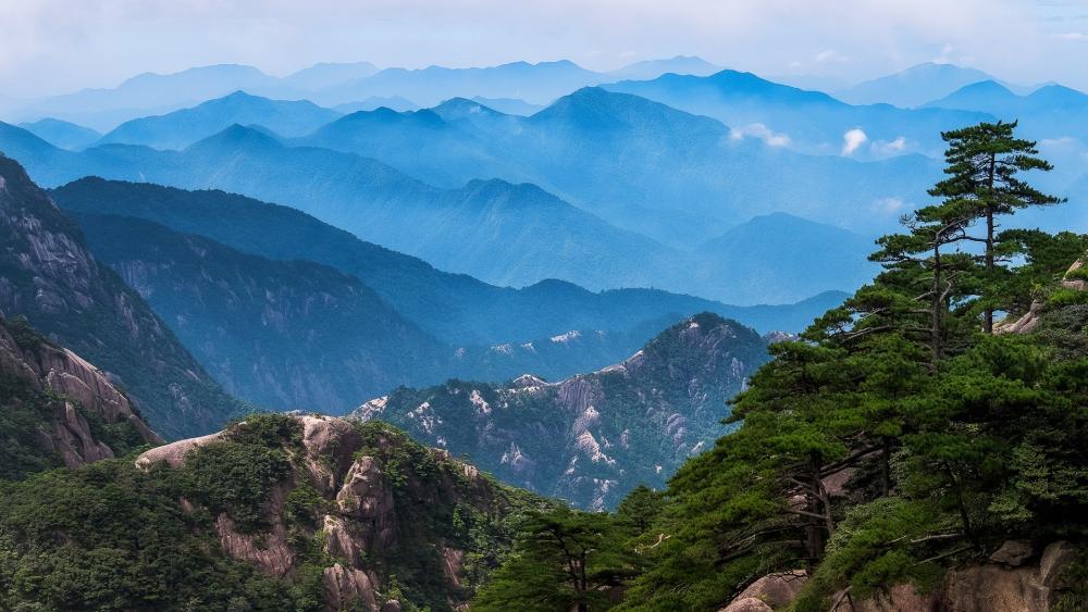 Mountain Serenity in Blue Hues wallpaper