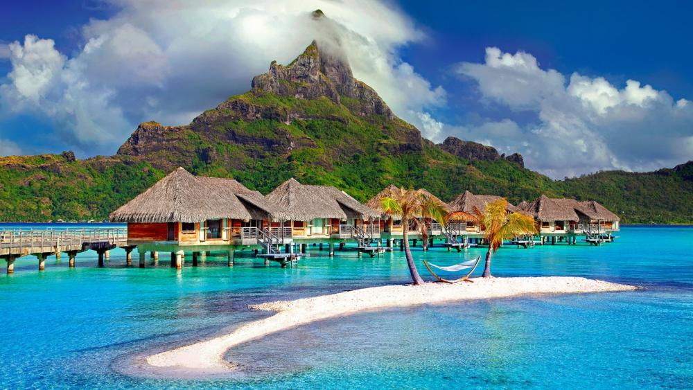 Bungalows in the middle of the beach in Bora Bora wallpaper