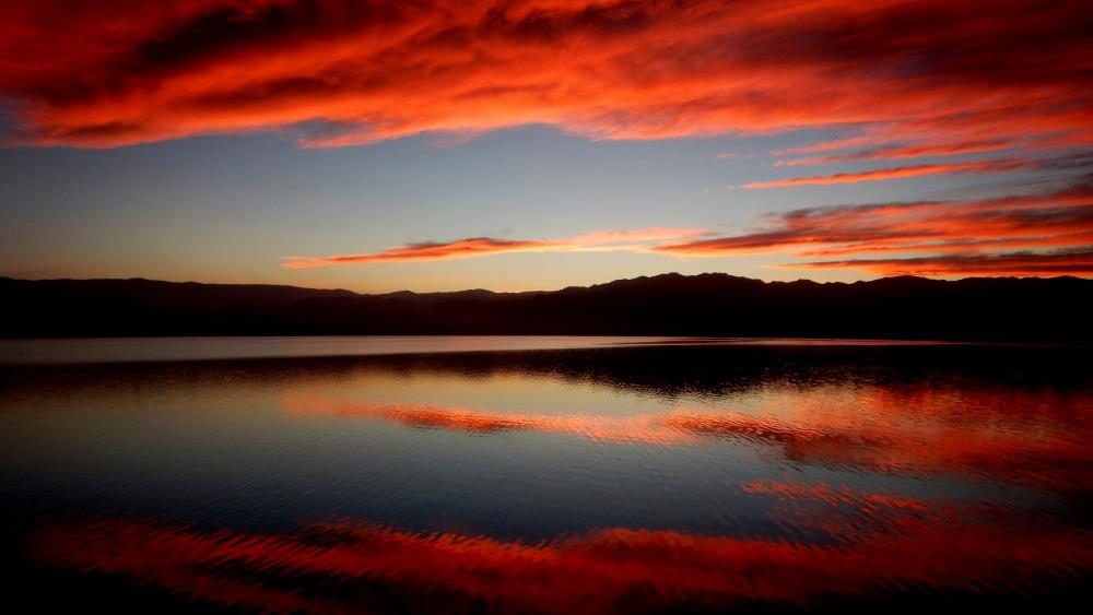 Fiery Sky Reflected on Tranquil Waters wallpaper
