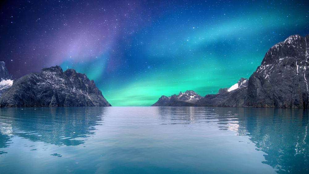 Mystical Northern Lights Over Tranquil Sea wallpaper