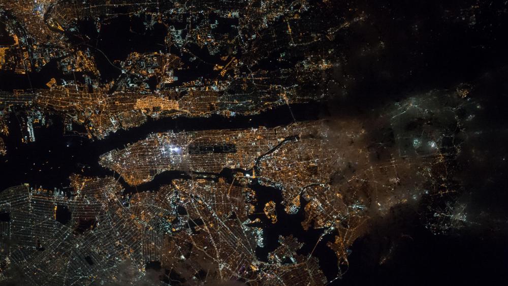 Astronaut's View of New York City at Night wallpaper