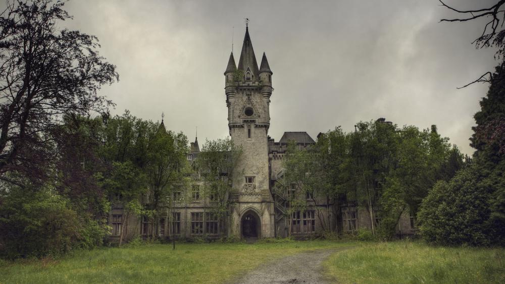 Mystical Castle Amidst Lush Greenery wallpaper