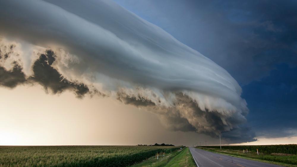 Majestic Storm Clouds Over the Open Road wallpaper