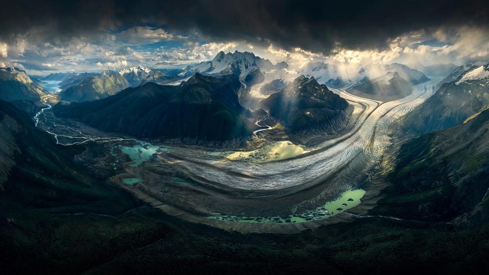 Majestic Glacier Landscape Under Dramatic Skies wallpaper