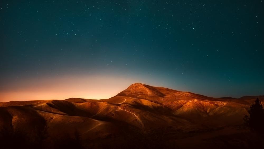Serene Night Over Majestic Mountains wallpaper