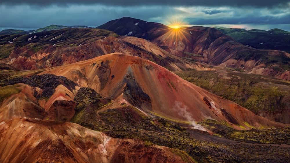 Majestic Sunrise Over Volcanic Landscape wallpaper