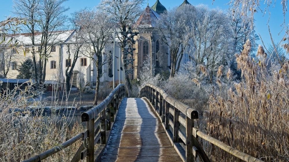 Serene Winter Bridge Amid Frosty Landscape wallpaper