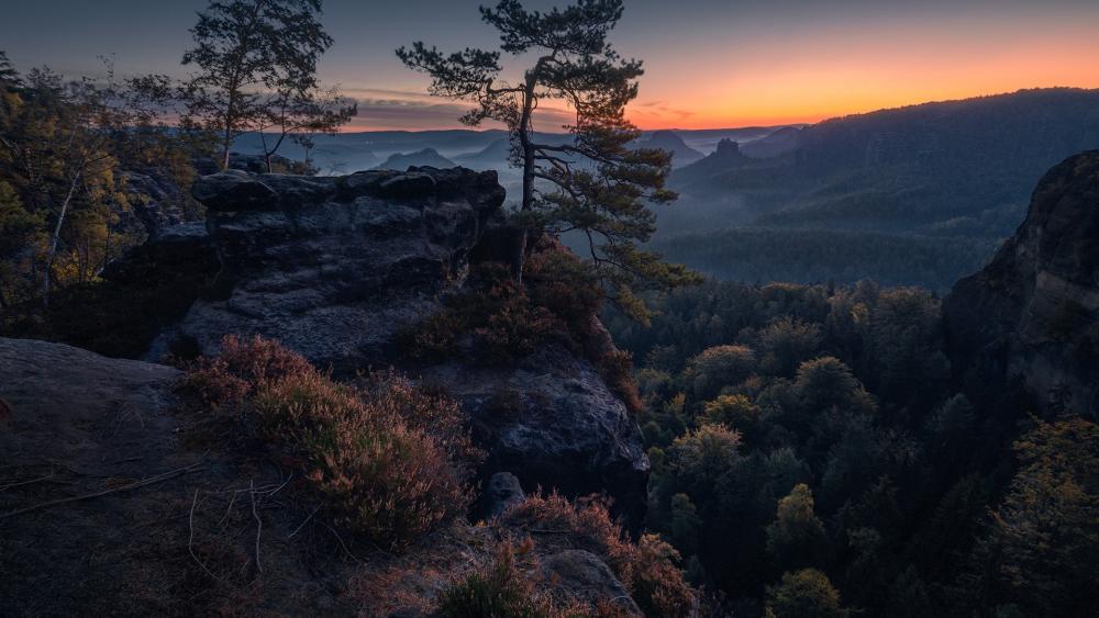 Majestic Sunset Over Serene Mountain Landscape wallpaper