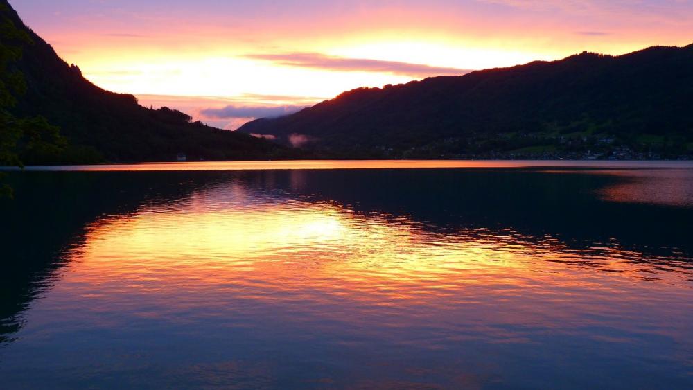 Serene Sunset Over Tranquil Lake View wallpaper