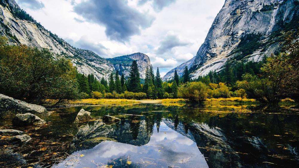 Majestic Mountain Reflections in Nature's Embrace wallpaper