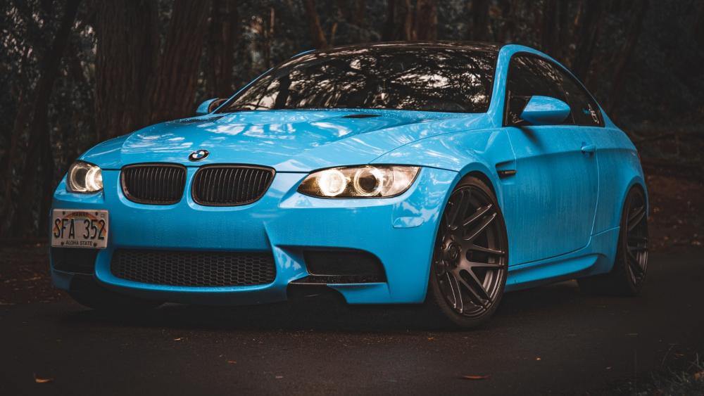 Sleek Blue BMW in the Forest wallpaper