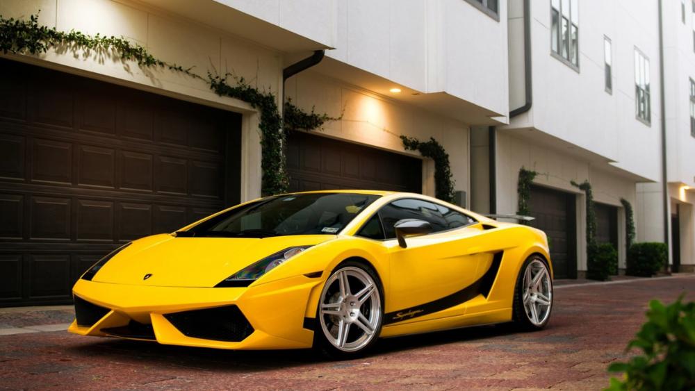 Vibrant Yellow Lamborghini Gallardo in Urban Setting wallpaper