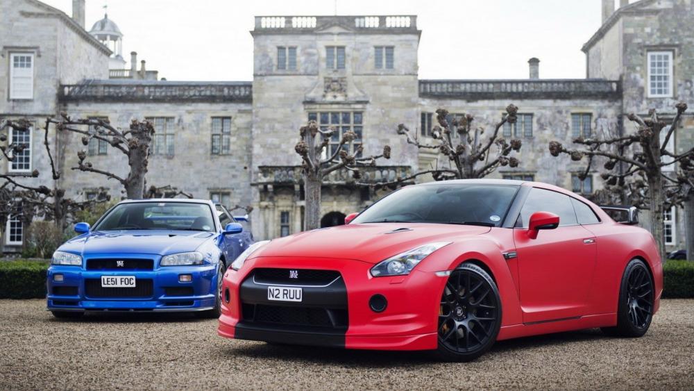 Dynamic Sports Cars in an Elegant Setting wallpaper