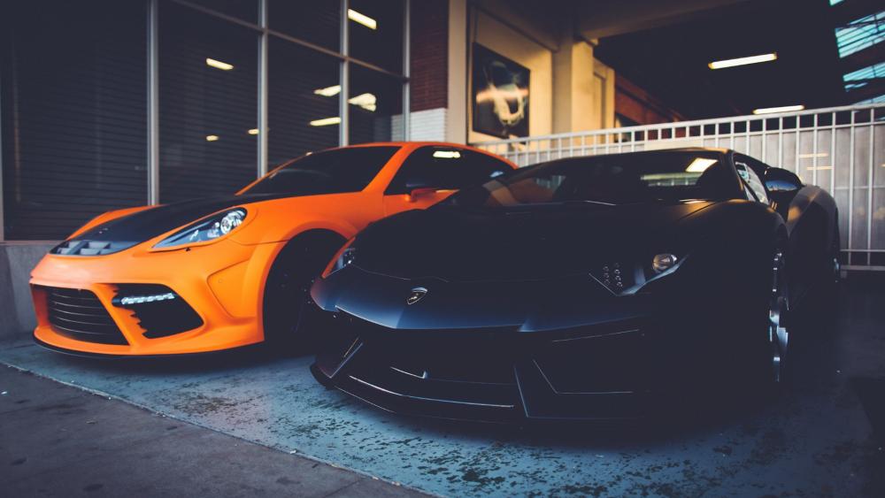 Sportscar Duo in Urban Garage Setting wallpaper