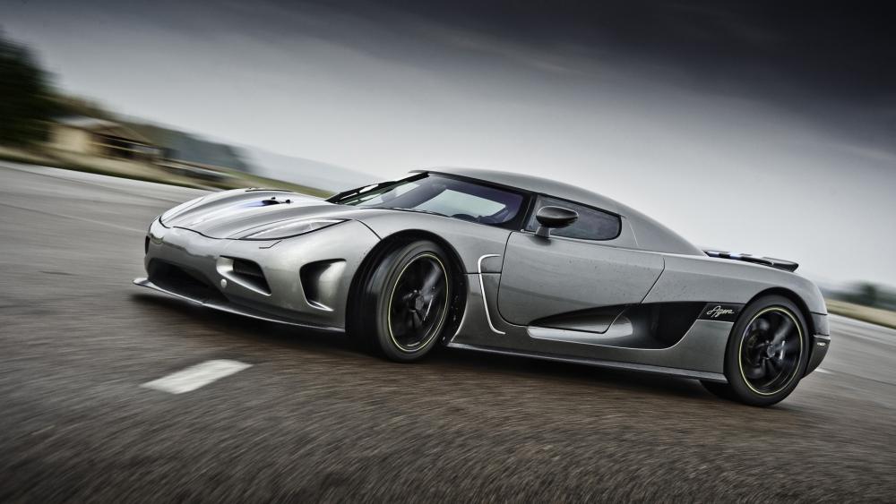 Sleek Silver Hypercar in Motion wallpaper