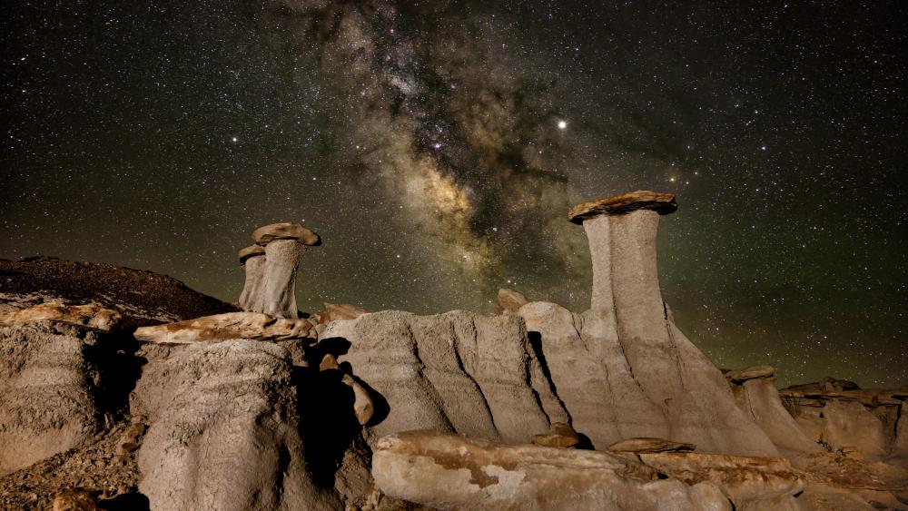 Starry Night Above Desert Monoliths wallpaper