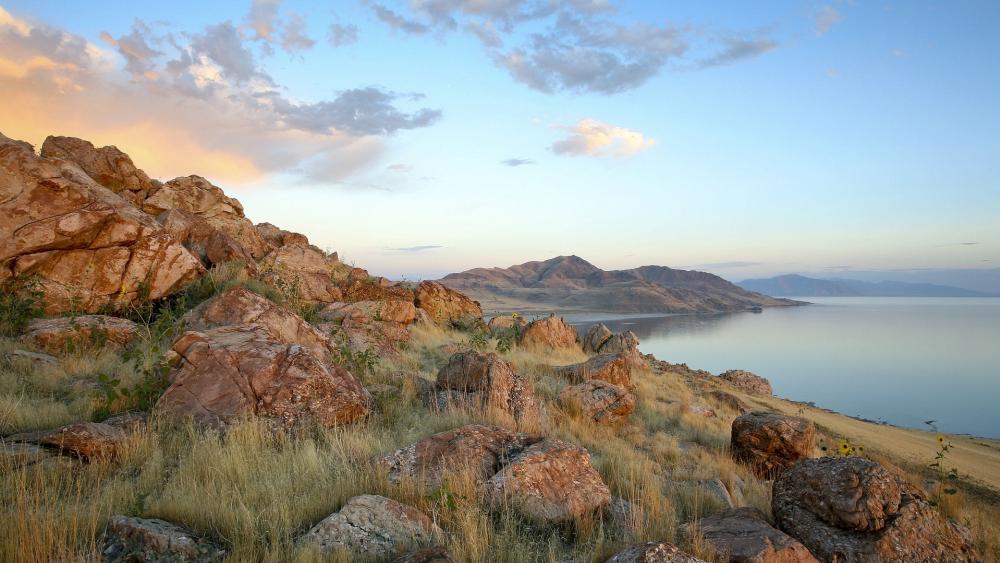 Serene Rocky Shoreline at Dusk wallpaper