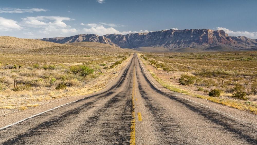 Endless Road Through Breathtaking Mountains wallpaper