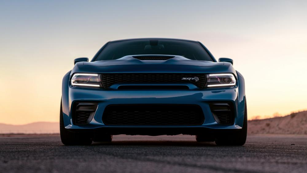 Sleek Blue Muscle Car at Sunset wallpaper