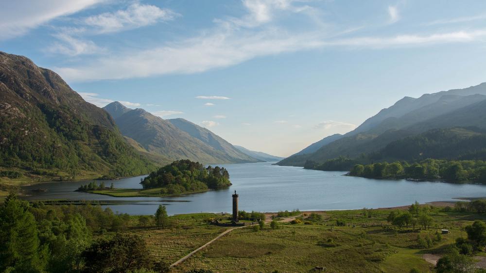Serene Highland Landscape with Water and Mountains wallpaper