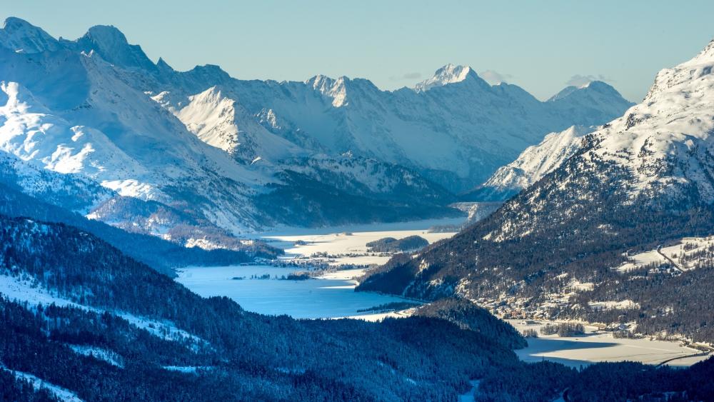 Majestic Snow-Capped Mountains Over Serene Lake View wallpaper