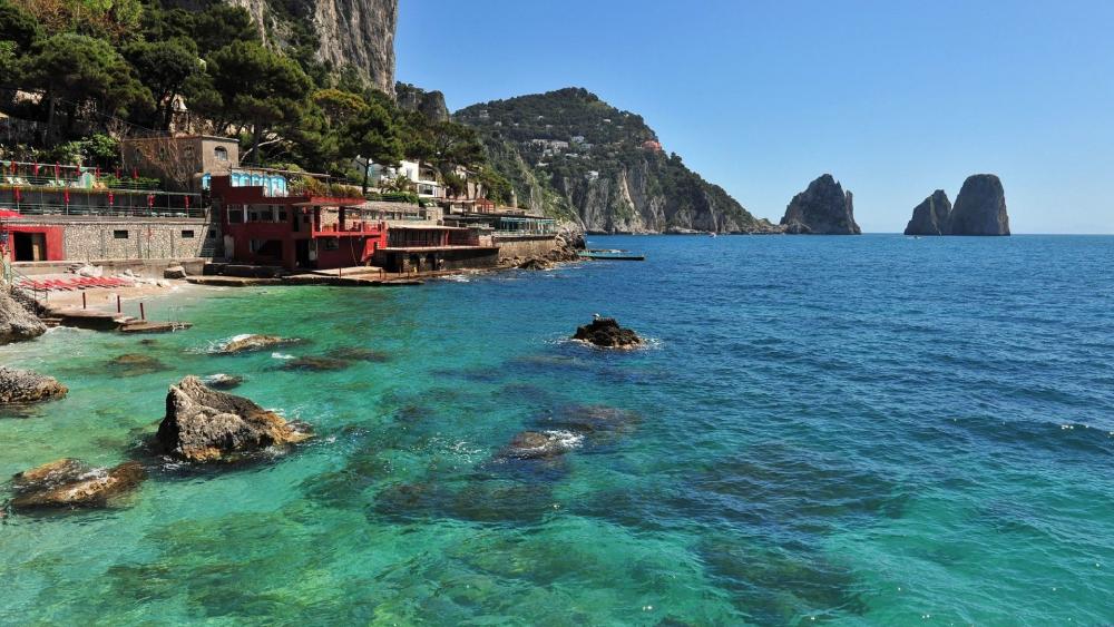 Serene Coastal Escape with Vibrant Waters wallpaper