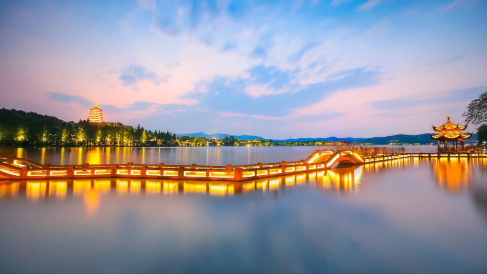 Serene Evening by the Lake in the City Lights wallpaper