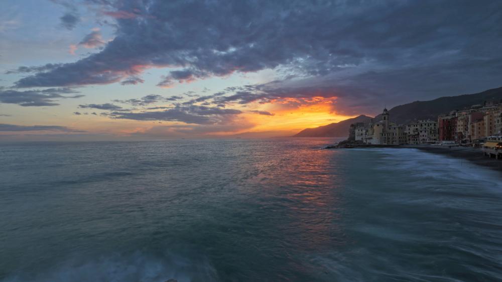 Tranquil Sunset Over Coastal Cityscape wallpaper
