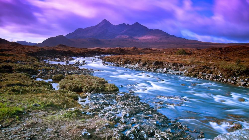 Serene Landscape with Majestic Mountains and Flowing River wallpaper