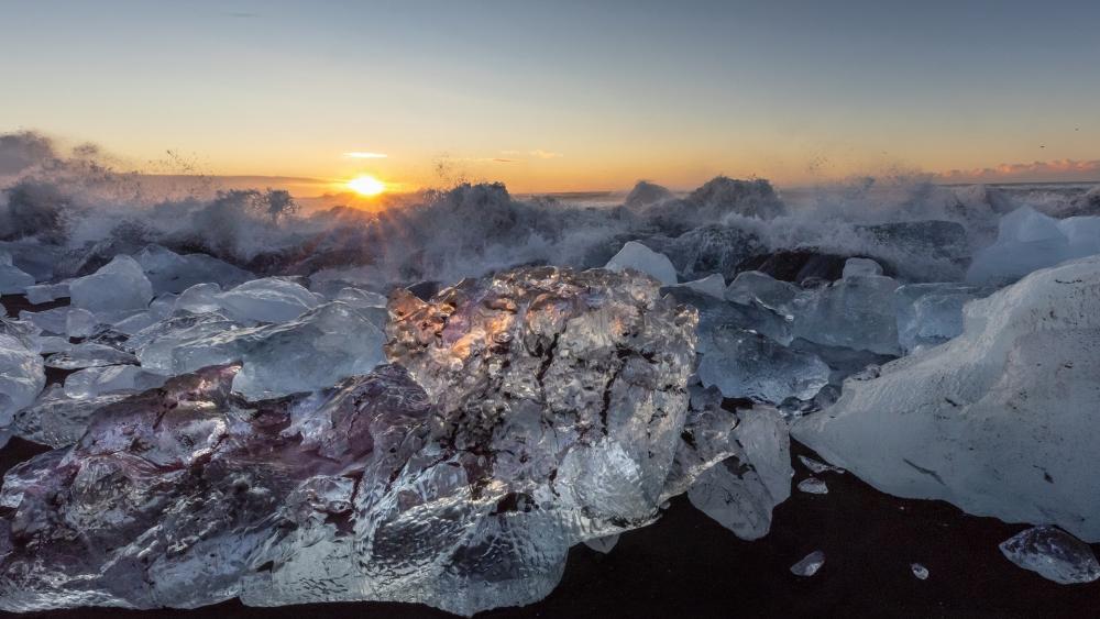 Shimmering Ice and Waves at Sunset wallpaper