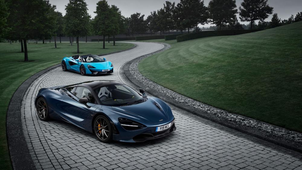 Stunning McLaren Supercars on a Scenic Drive wallpaper