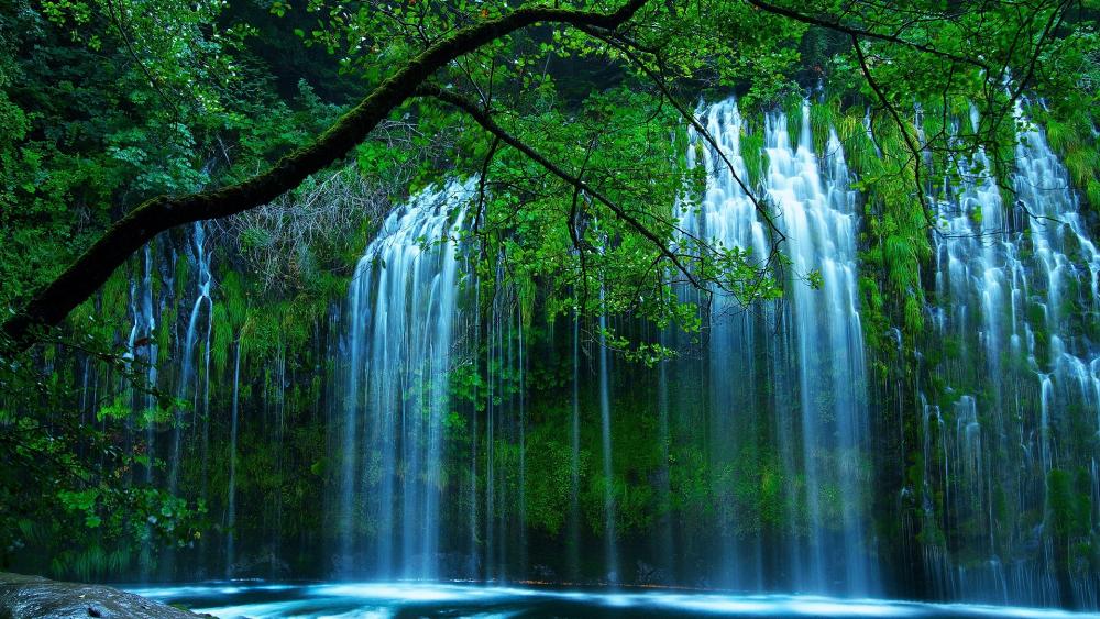 Serenity of Cascading Waterfalls in Lush Greenery wallpaper