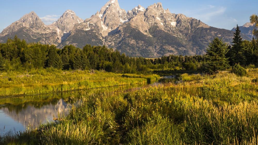 Majestic Mountains Reflected in Tranquil Waters wallpaper