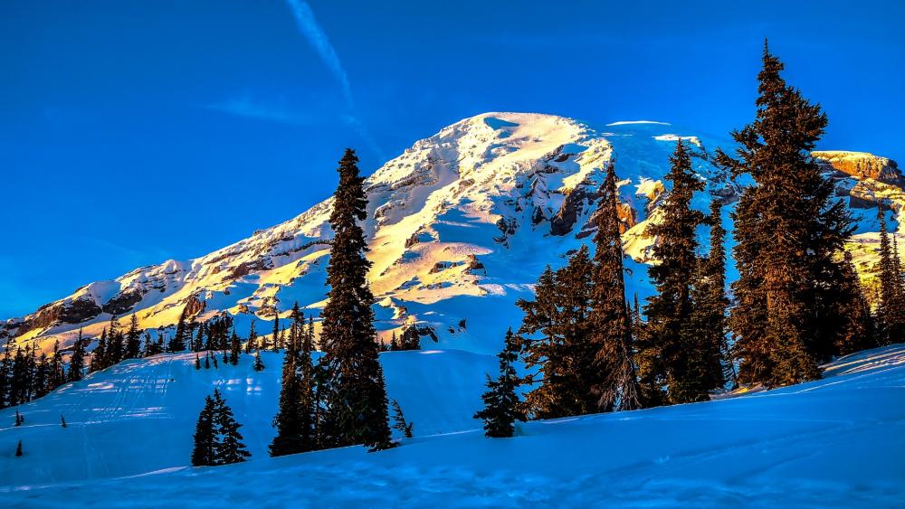 Majestic Snow-Capped Mountain Under Clear Blue Sky wallpaper