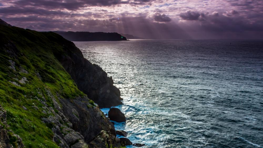 Majestic Cliffs Overlooking Tranquil Waters wallpaper
