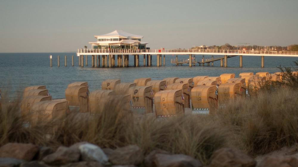 Tranquil Beachside Retreat with Charming Cabanas wallpaper