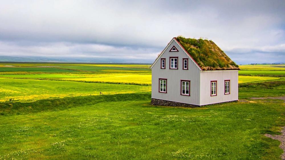 Serene Country Landscape with a Unique House wallpaper