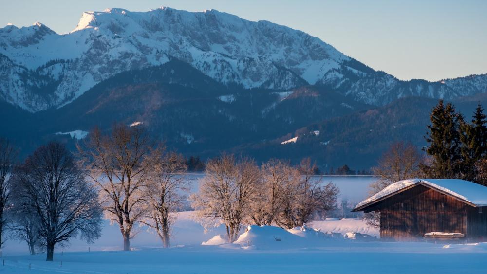 Majestic Winter Landscape with Snowy Mountains wallpaper