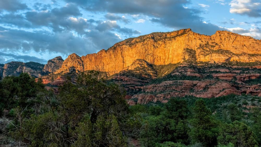 Majestic Mountains Bathed in Golden Light wallpaper