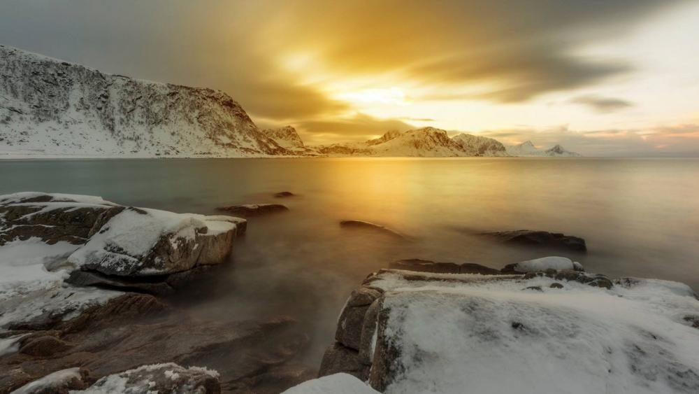 Serene Sunset Over Snowy Mountain Landscape wallpaper