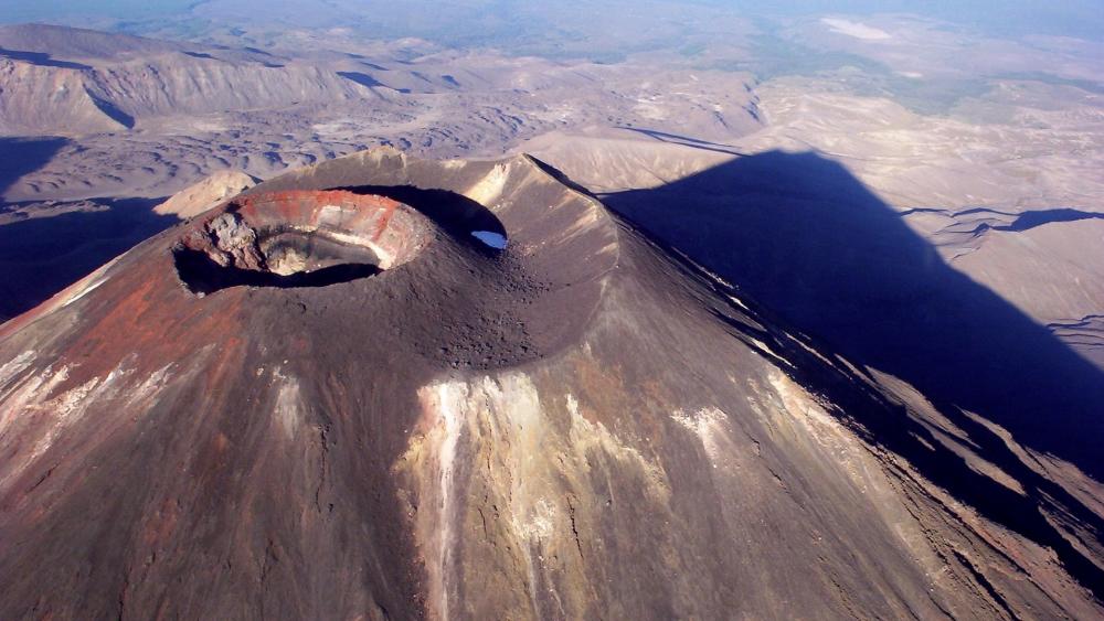 Majestic Volcano Overlooking Vast Landscape wallpaper