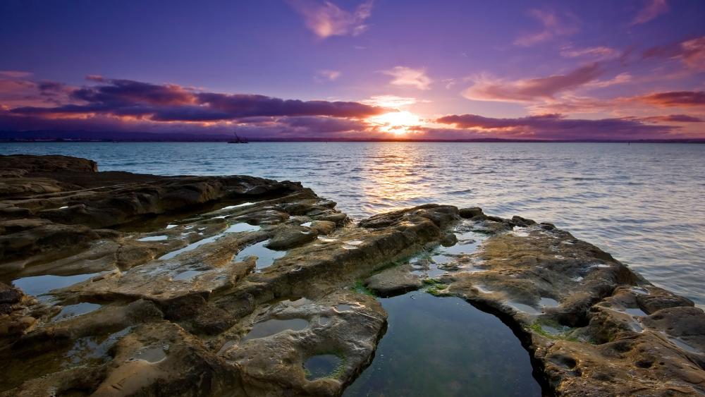 Serene Sunset Over Tranquil Waters wallpaper
